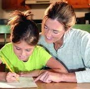 A mom helping her daughter with homework